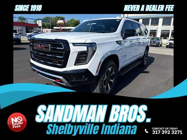 2026 GMC Yukon XL AT4 in Summit White — front three-quarter view