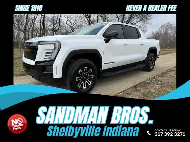 2026 GMC Sierra EV Elevation Standard Range in Summit White — front three-quarter view