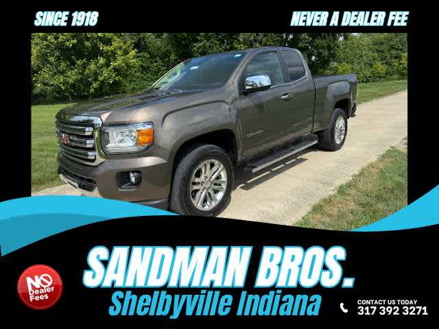 2015 GMC Canyon 4WD SLT in Bronze Alloy Metallic — front three-quarter view